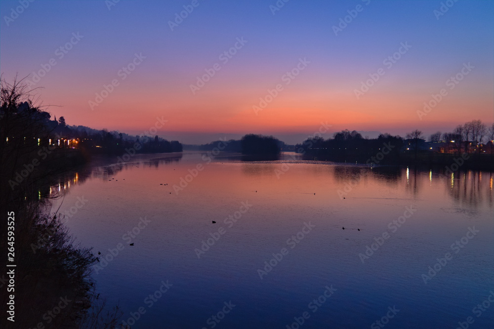Romantic purple sunset on the Po river in San Mauro Torinese, near Turin, Piedmont, Italy