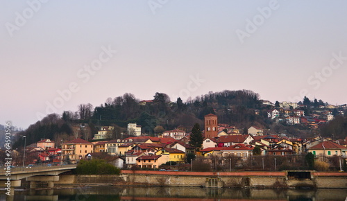 View of San Mauro Torinese, little village near Turin, Piedmont, Italy, on the Po river under a hill, at sunset