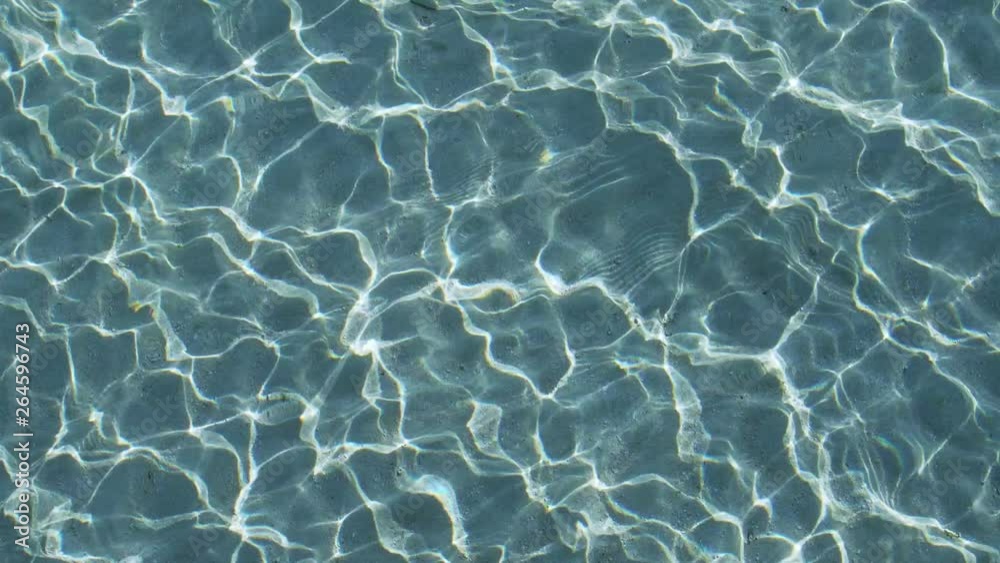 surface of blue water ripple background, rock and sand under clear water., Lockdown.