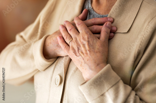Senior Woman Suffering From Chest Pain © pikselstock