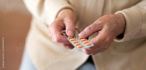 Senior woman about to take her medication