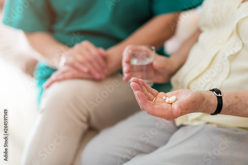 Senior woman about to take her medication