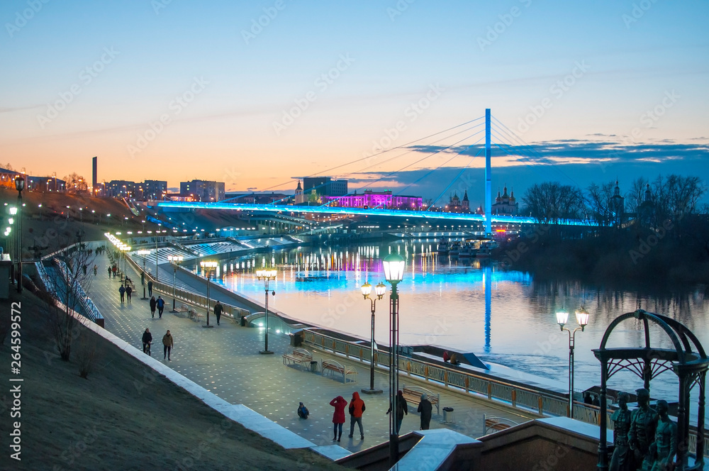 Tyumen, Russia, on April 19, 2019: A spring high water on the embankment in Tyumen in the evening.