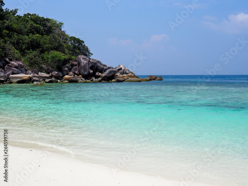 Paradise island blue sea and white beach with blue sky © bp19