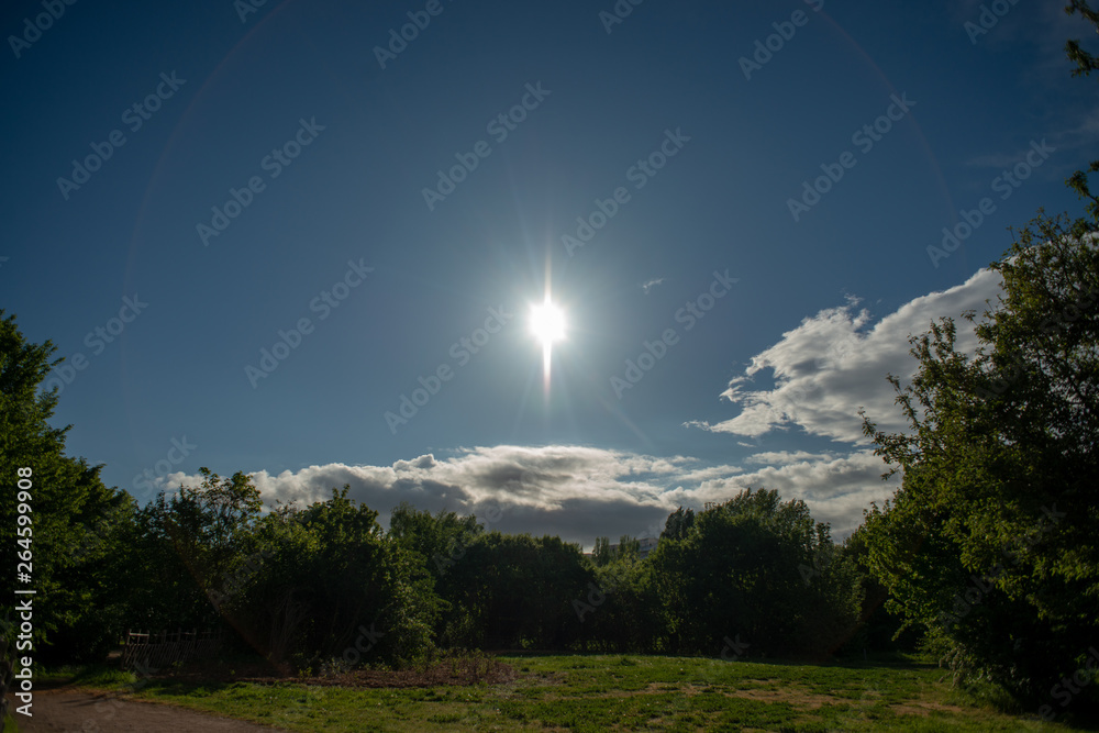 Issy Spring Blue sky with clouds and direct sun on a spring afternoon in Issy-les ...