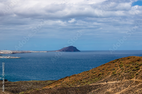Beautiful view on the faraway volcano with the blue ocean - Image