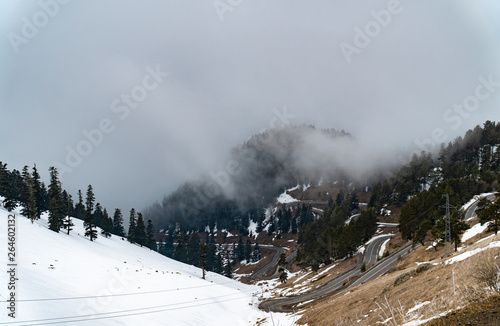 Scenic view of empty road with snow covered mountains and landscape in winter season.