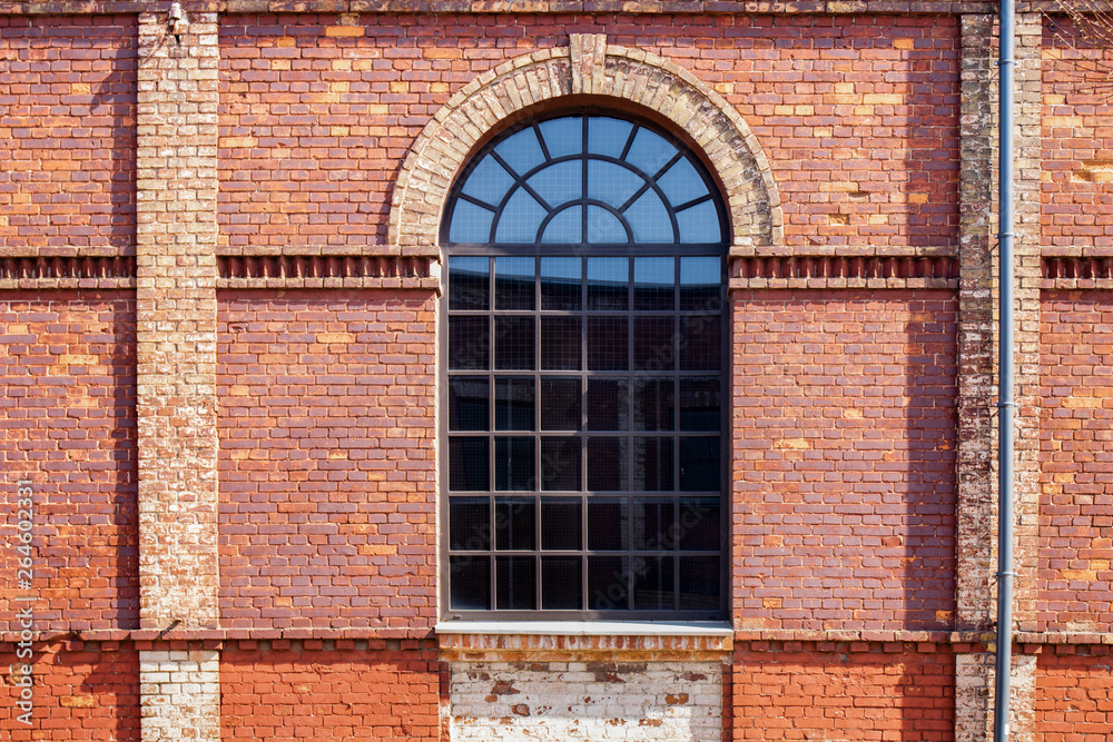 Walls and windows. Old brick wall with one big window.