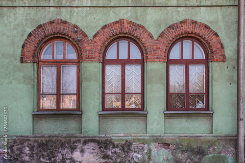Walls and windows.Old facade , wall with three windows. 