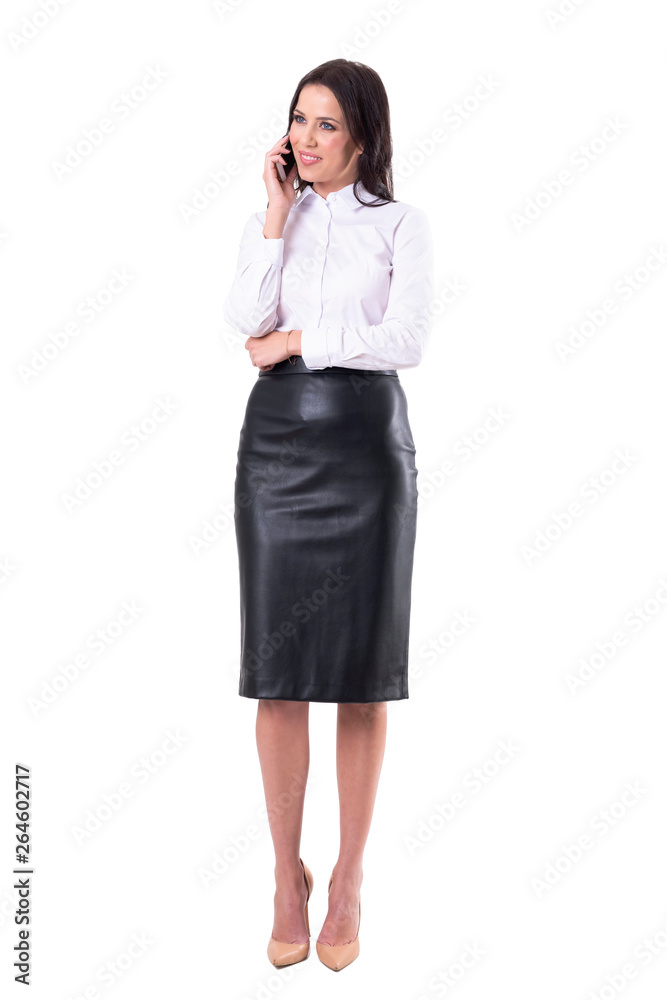 Happy friendly smiling young business woman having conversation over mobile phone. Full body isolated on white background. Happy friendly smiling young business woman having conversation over mobile phone. Full body isolated on white background.