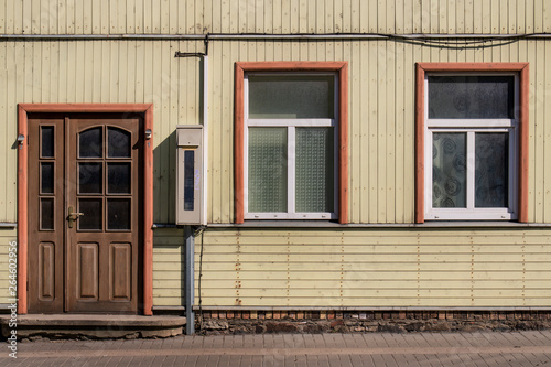 Walls and windows.The facade of the wooden house  door and windows