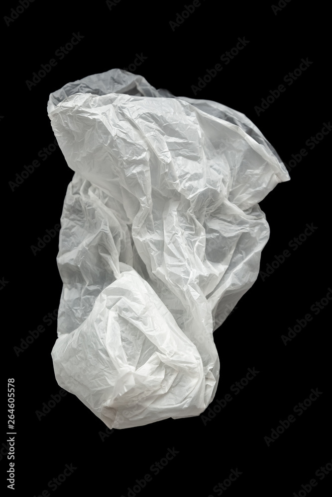 Plastic bag on a black background, isolate. Used plastic bag for recycling. Recycling of plastic waste into pellets as a business.