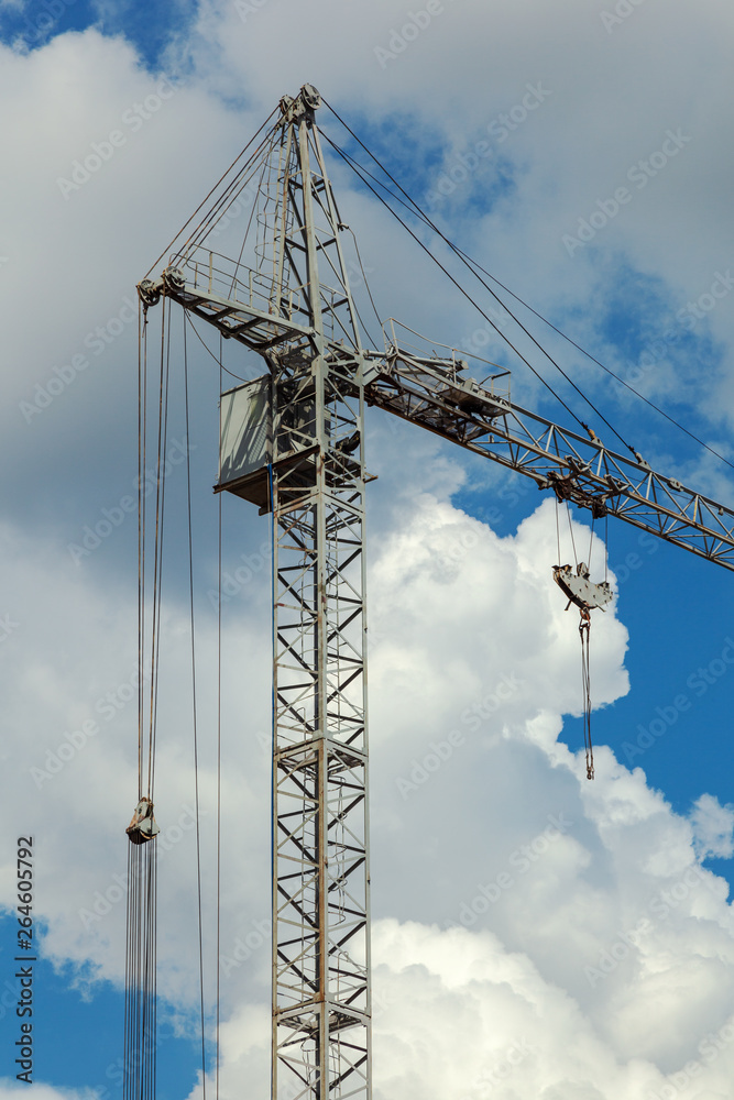 Industrial crane working on a construction site. Industrial crane working on a construction site.