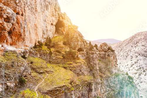 Beautiful view of a sculptural mountains with greens and light.