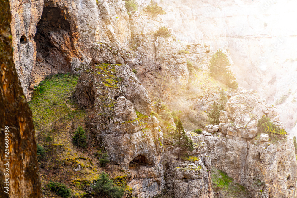 Beautiful view of a sculptural mountains with greens and light.