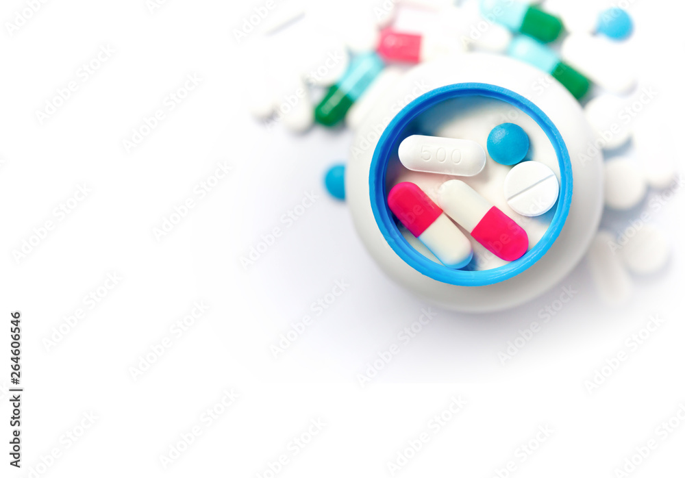Pills of various colors.The pill is placed in the lid of the medicine bottle.Close ups Pills of various colors.The pill is placed in the lid of the medicine bottle.Close ups