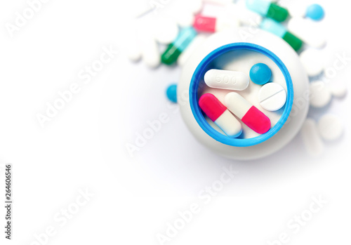 Pills of various colors.The pill is placed in the lid of the medicine bottle.Close ups