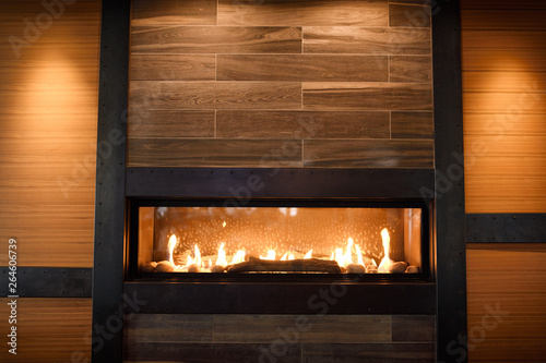 Modern gas fireplace in wall of Brewhouse restaurant Toronto photo