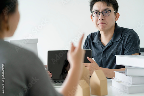 asian glasses man stress arguing with co worker in meeting room office background photo