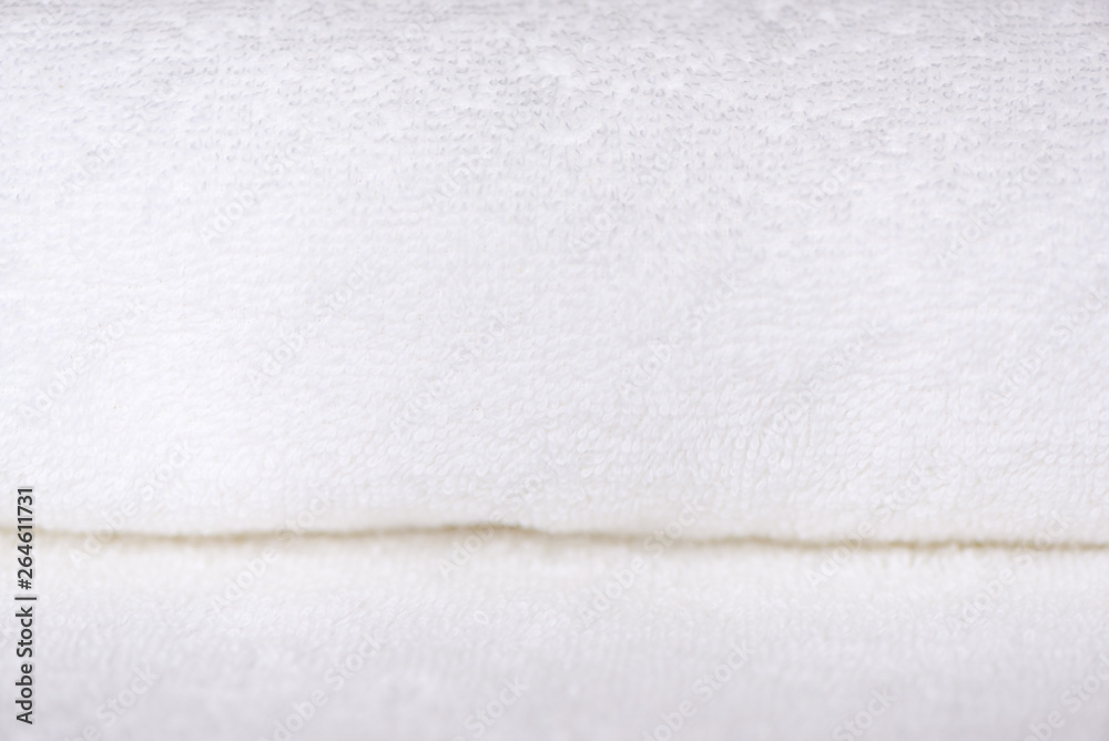 Obraz premium White delicate soft background of fur plush smooth fabric. Clean white new terry towel rolled blanket textile