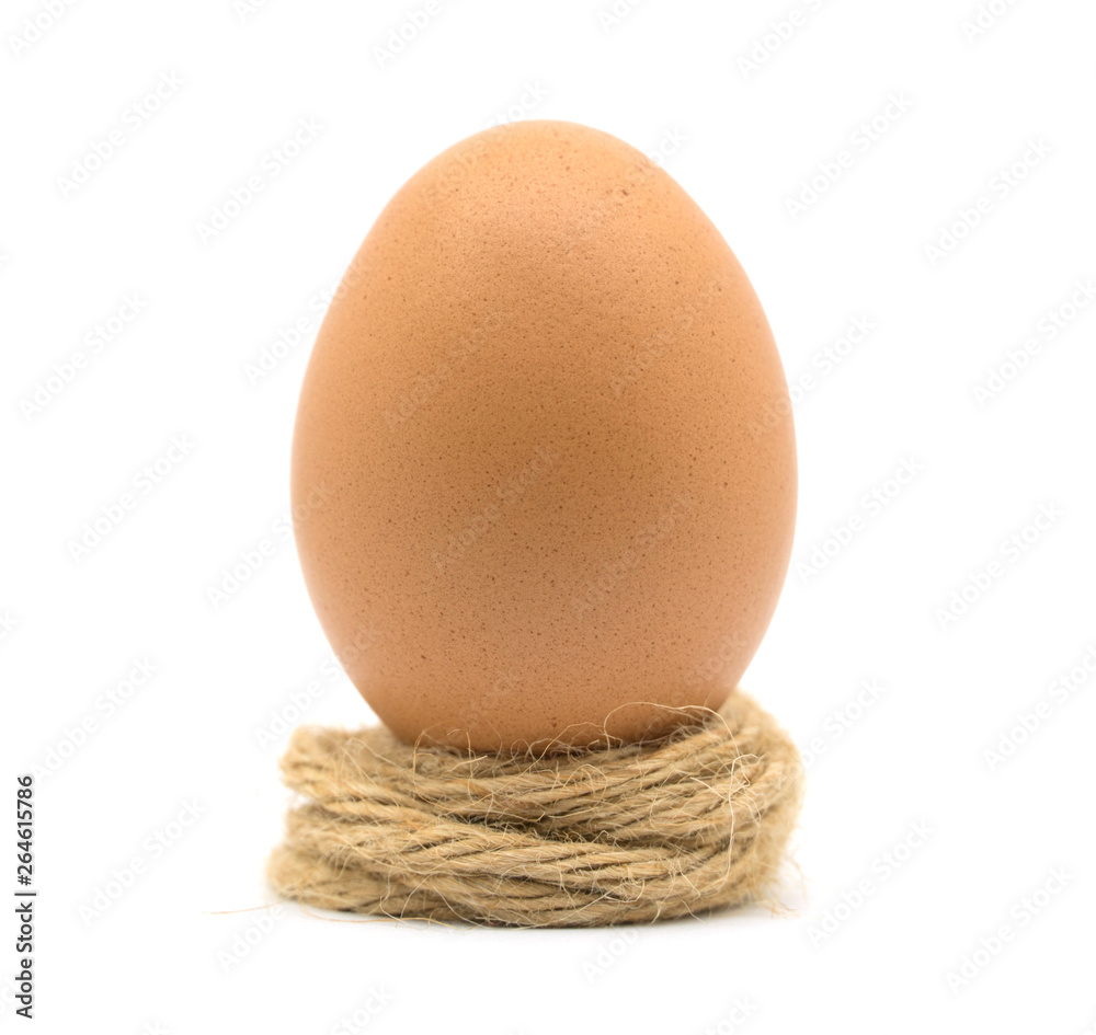 Egg chicken on brown rope white background Egg chicken on brown rope white background