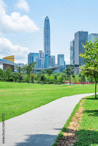The large grassland of Shenzhen Lianhuashan Park and the CBD building of Futian District