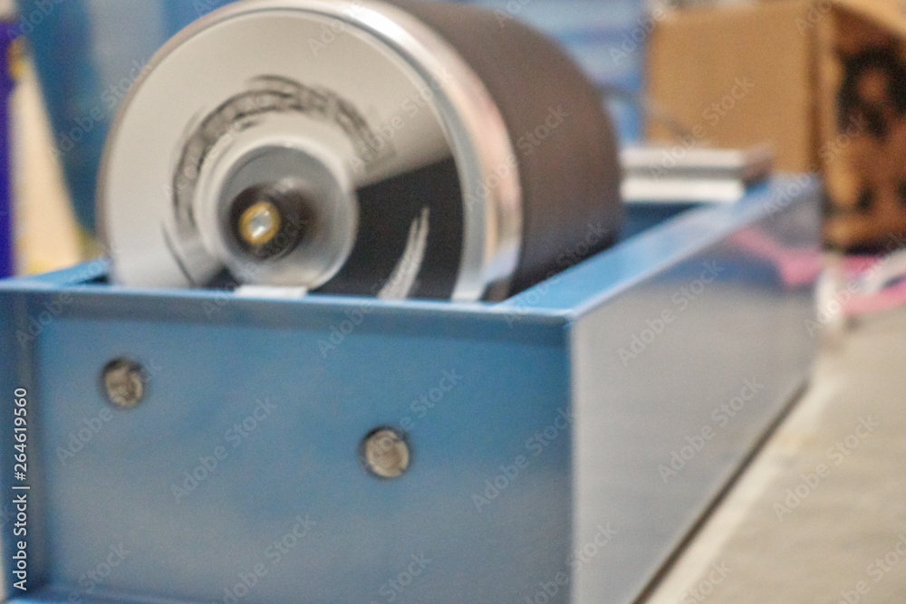 Rock tumbler with barrel in motion Rock tumbler with barrel in motion