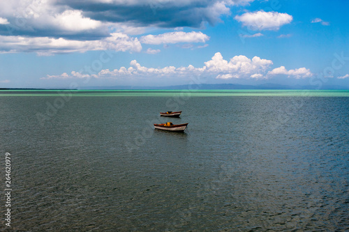 Fototapeta Naklejka Na Ścianę i Meble -  Tropical paradise typical scenery: colored wooden boats docked in the sea. Miches Bay or Sabana De La Mar lagoon, northern Dominican Republic, Samana area.