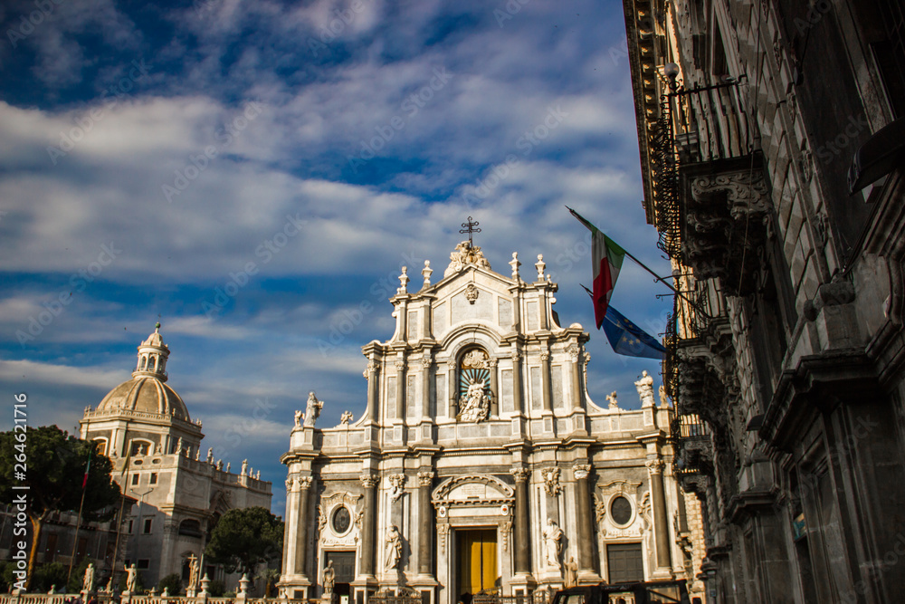 Catania cathedral front view with baroque architecture building and dome