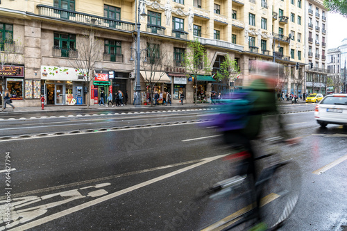 A man on a bycycle rushing through a street in Budapest © michabo19