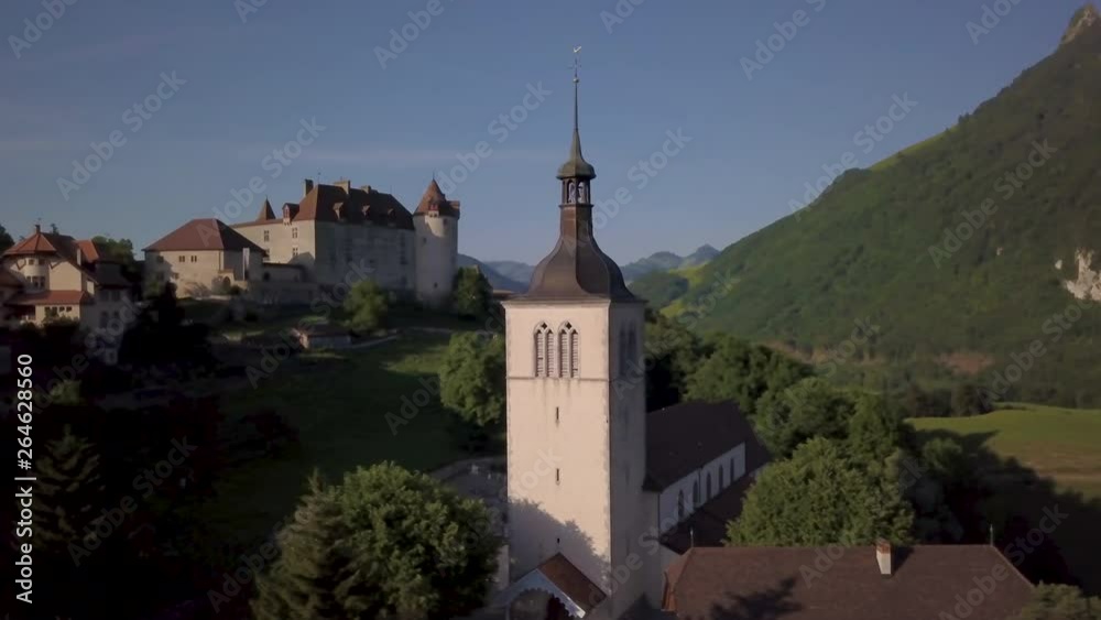 25P counter clockwise circling church tower with town of Gruyere in background 25P counter clockwise circling church tower with town of Gruyere in background