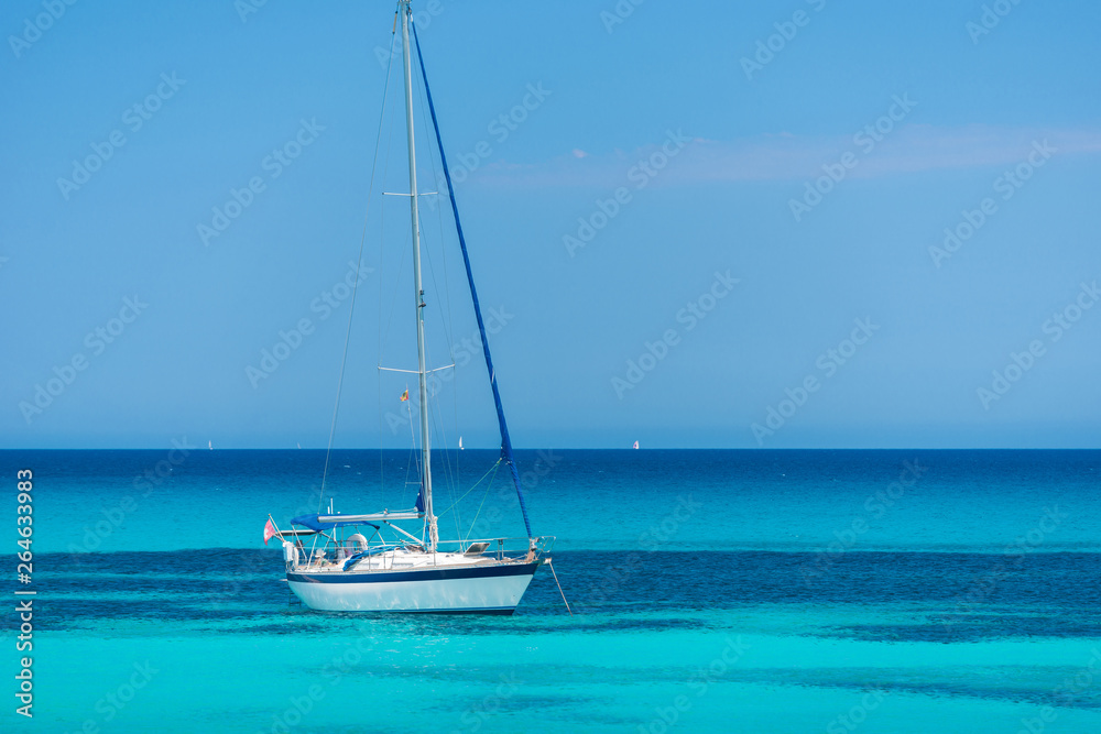Anchored sailing yacht on the turquoise sea Anchored sailing yacht on the turquoise sea