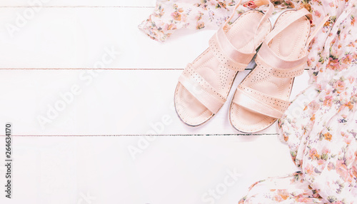 summer women's sandals on white background top view. copy space. summer clothes. summer sandals flat lay.