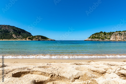 Voidokilia Beach, popular white sand and blue clear water beach in Messinia in Mediterranean area in shape of Greek letter omega, Peloponnese, Greece.