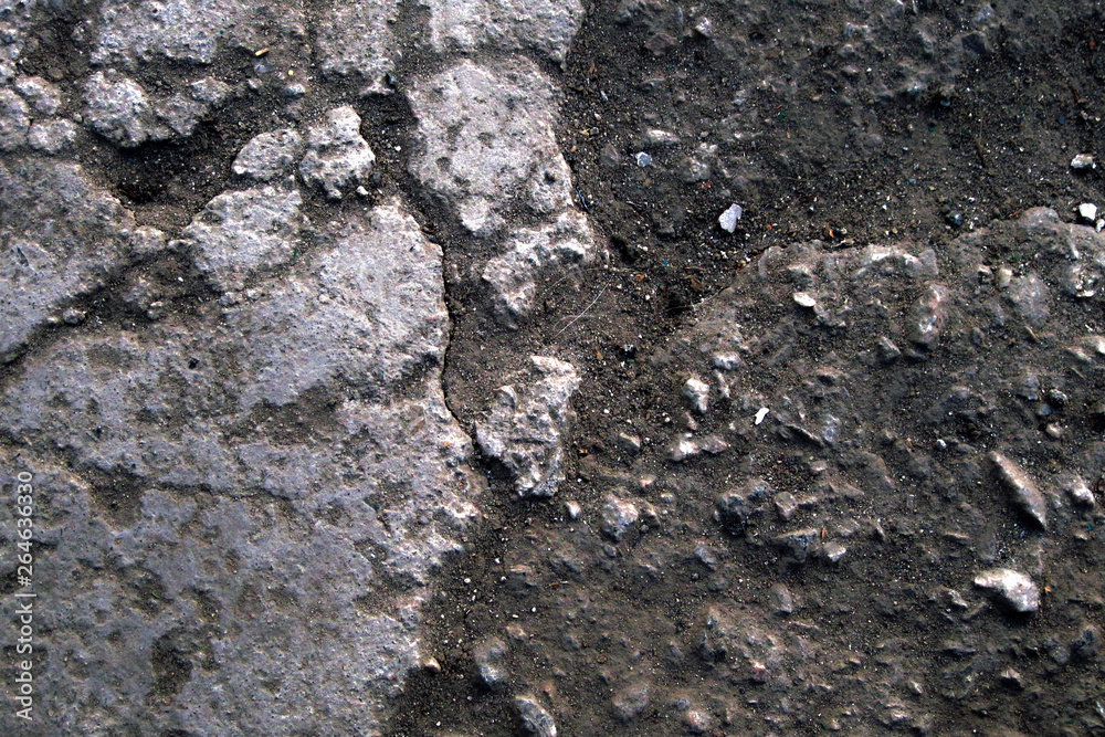 Stone and soil texture background with dust and granular particles. Close up macro of rustic terrain in blue tint Stone and soil texture background with dust and granular particles. Close up macro of rustic terrain in blue tint