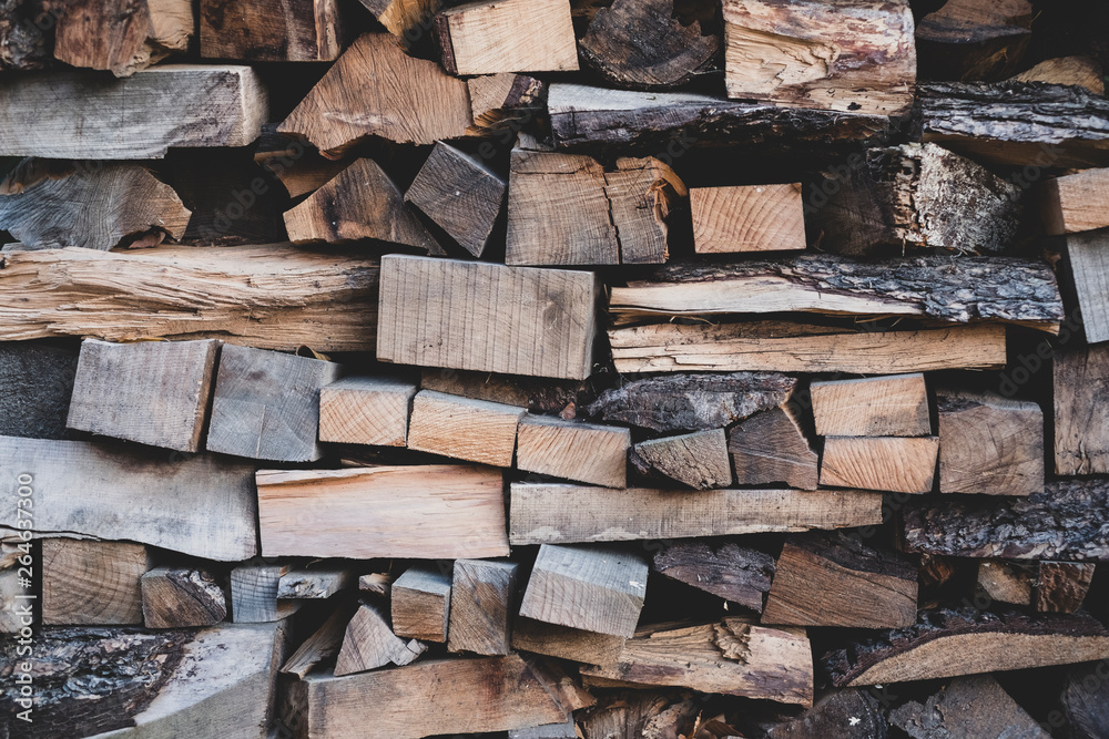 Close up of stack of wooden logs.