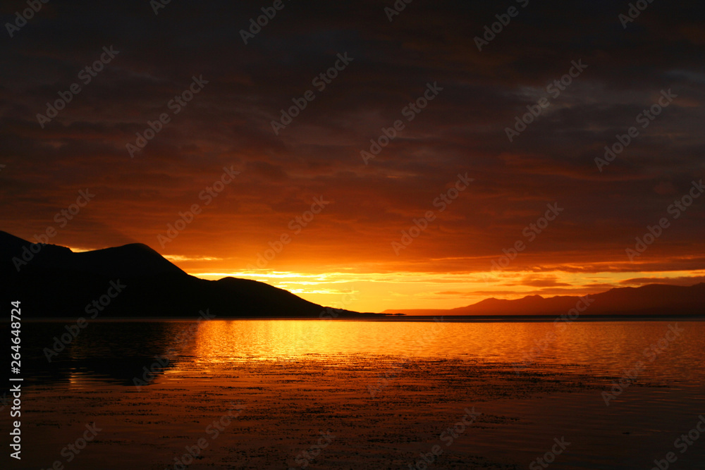 Fototapeta premium Ushuaia harbour (Argentina) with stunning sunset. One of the most southern most cities in the world.