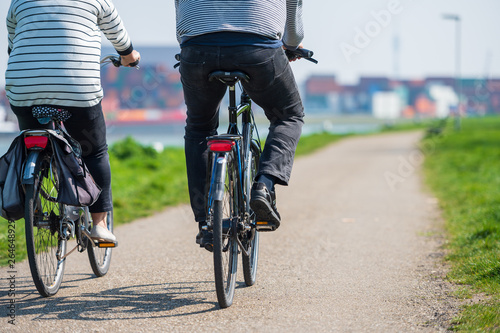couple riding bikes © Lari