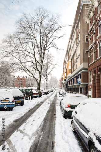 Snow-covered street Hugo de Grootkade in Amsterdam during a cold winter in the Netherlands. Hugo de Grootkade.