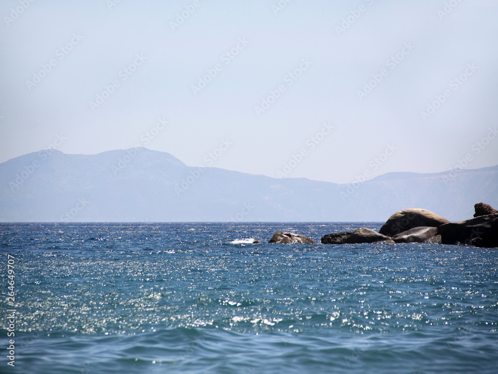 Fototapeta premium Seascape. Coast , coastline. The rocks in the distance. Tourism concept. Vacation , vacation on the sea or ocean.