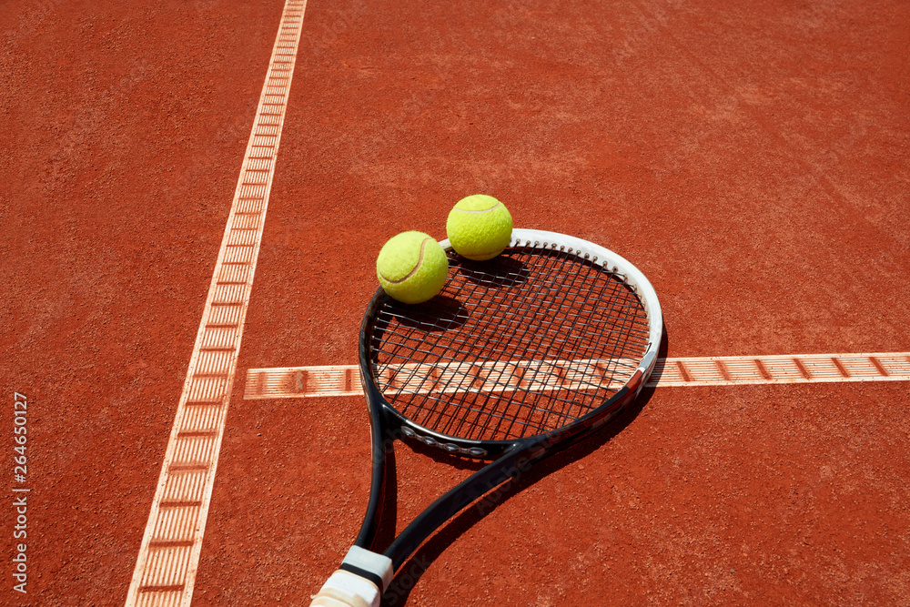 Close up of tennis balls on racket