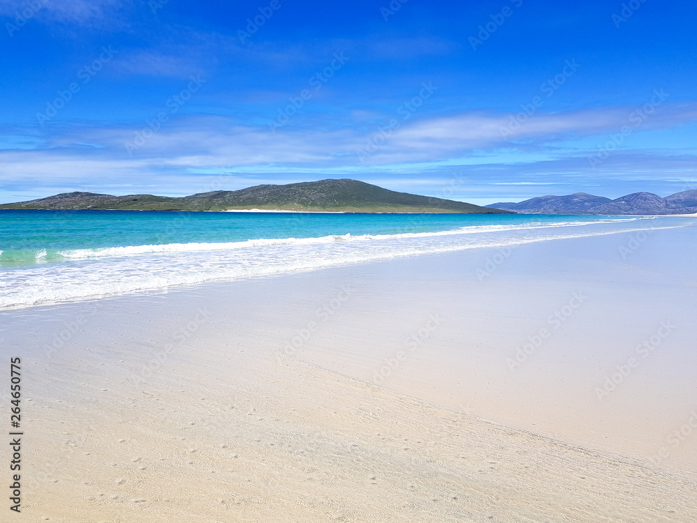 White sandy beach and blue sea