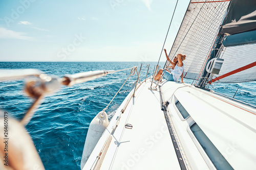 Young couple enjoying view on cruise ship deck..