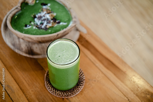 One piece of vegan raw chocolate avocado brownie cake on wooden table. Sugar free, wheat free, dairy free, flourless dessert. Dark mood food photo, blogging. Healthy eating, lifestyle concept photo