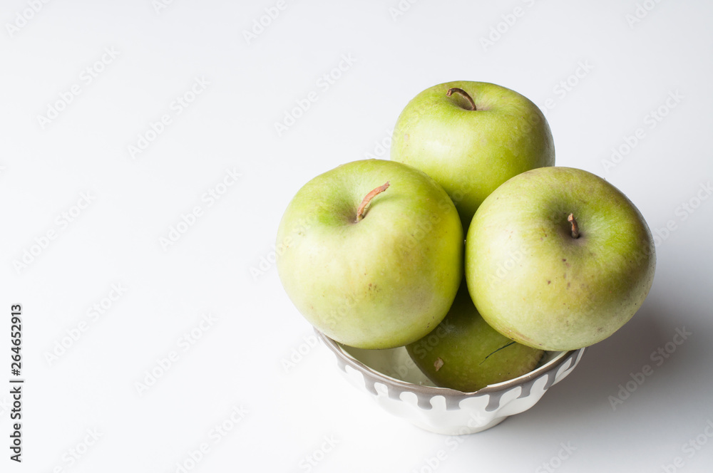 Green apple isolated on a white background.Apple peeling Green apple isolated on a white background.Apple peeling