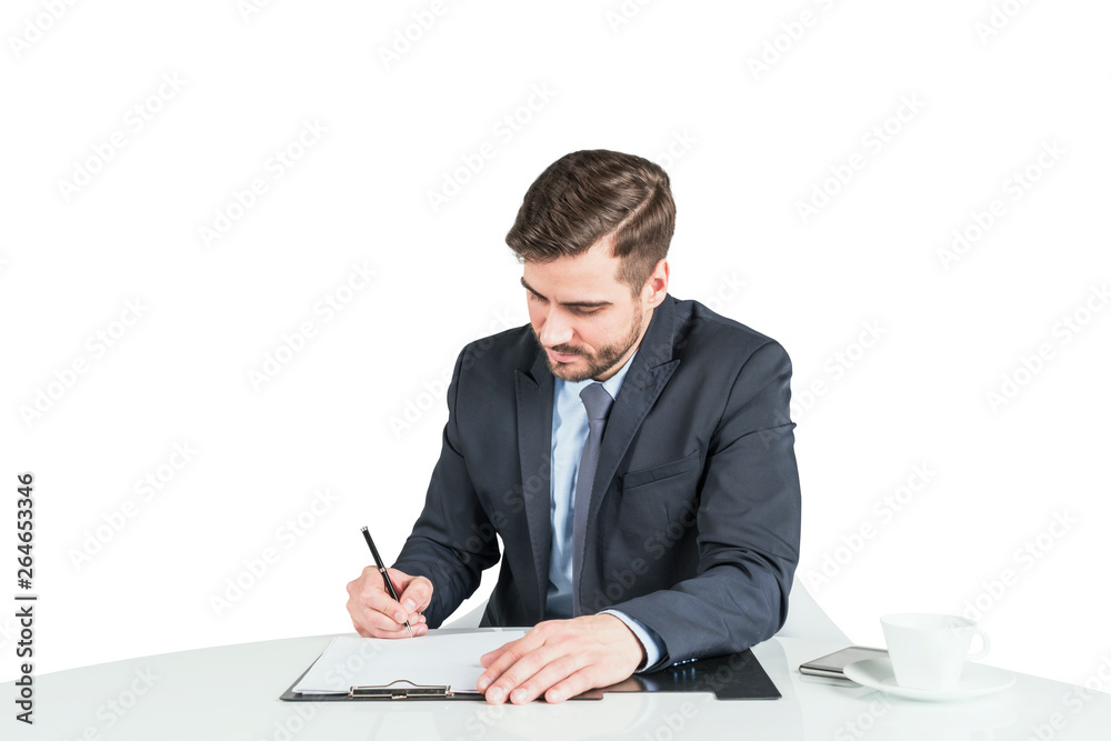 Serious man in suit signing contract at table Serious man in suit signing contract at table