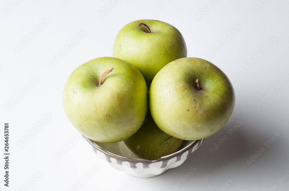Green apple isolated on a white background.Apple peeling Green apple isolated on a white background.Apple peeling