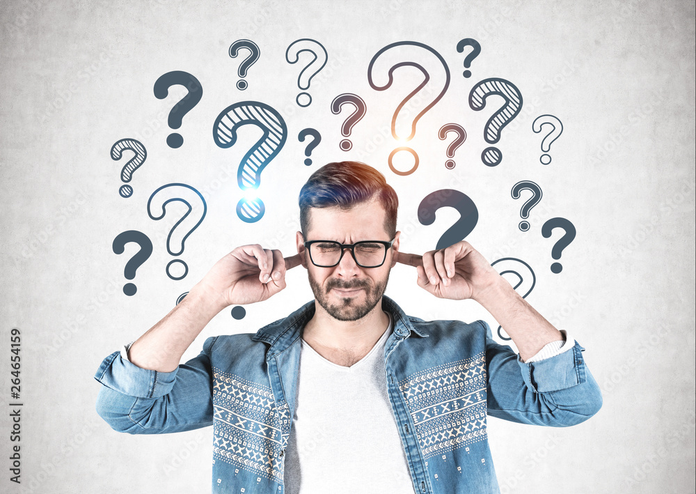Man covering ears, question marks Man covering ears, question marks