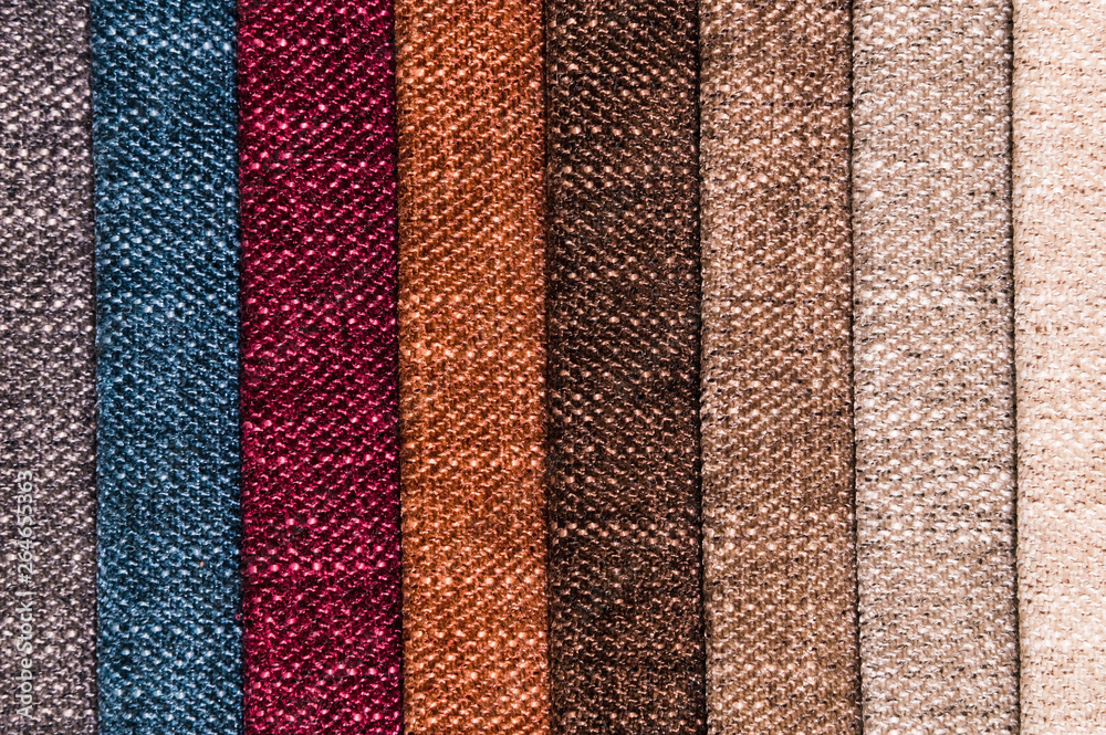A set of samples of fabric furniture decoration lines of textile textures. Multicolored stripes upholstery. Mode and tone for a luxurious interior style. Abstract background