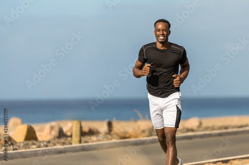 Принти на полотні Black african american young man running outdoor